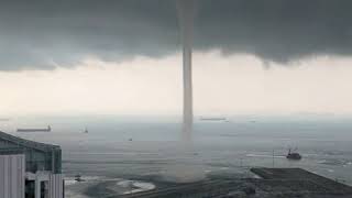 Massive waterspout looms off Singapore coast [upl. by Ellinet]